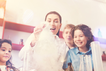 Funny woman expressing positivity while doing experimentの写真素材