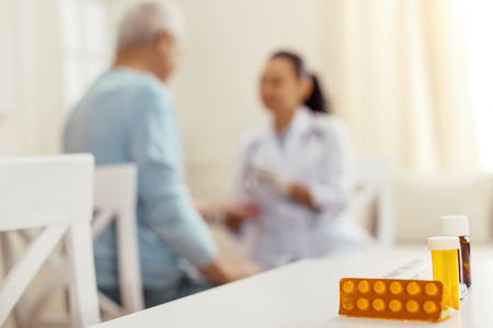 Selective focus of different pills standing on the tableの写真素材