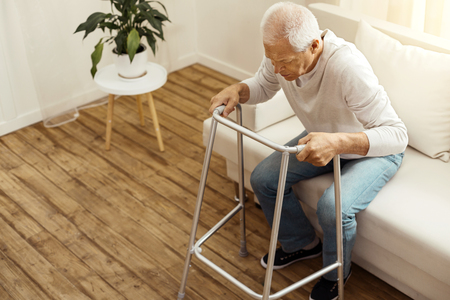Confident aged man trying to walkの写真素材