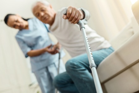 Professional walking stick being held by a nice elderly manの写真素材
