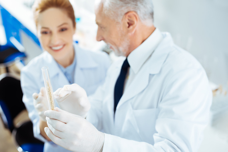 Smiling colleagues having friendly discussionの写真素材