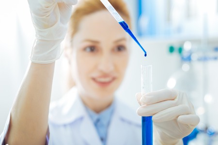 Portrait of positive scientist that doing chemical experimentの写真素材