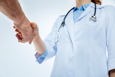 Medical professionals shacking hands togetherの写真素材
