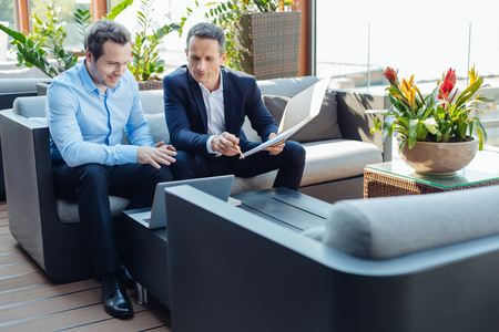 Positive business partners discussing a dealの写真素材