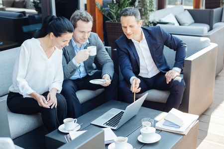 Delighted positive businesspeople looking at the presentationの写真素材