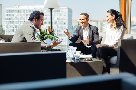 Delighted handsome businessman being in a good moodの写真素材