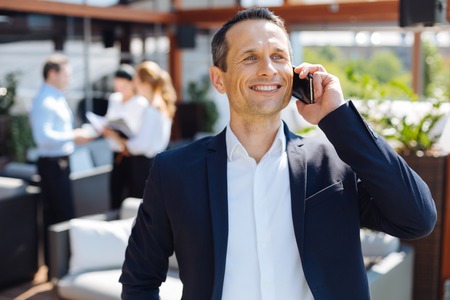 Positive cheerful businessman feeling happyの写真素材