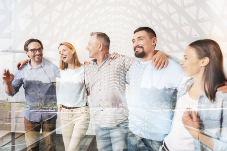 Cheerful office workers bonding to each otherの写真素材