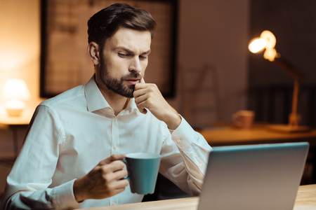 Thoughtful office worker having ideaの写真素材