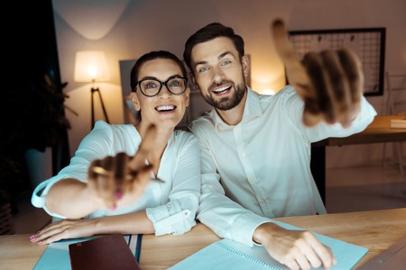 Attractive female sitting near her colleagueの写真素材