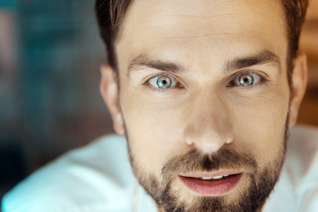Portrait of delighted man that looking forwardの写真素材