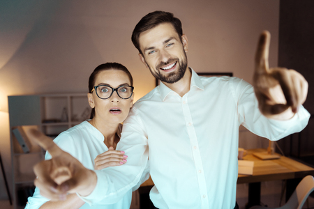 Handsome bearded man stretching his armsの写真素材