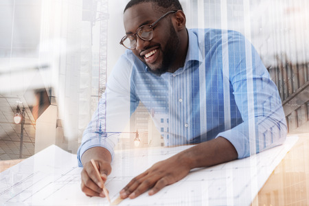 Close up of amused designer working in the officeの写真素材