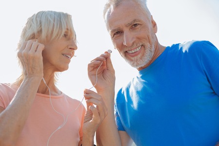 Close up of senior couple listening to the music together