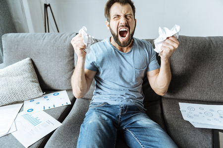 Emotional stressed out man expressing his angerの写真素材