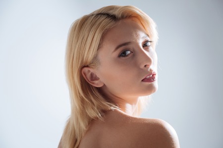 Emotional girl looking straight at cameraの写真素材