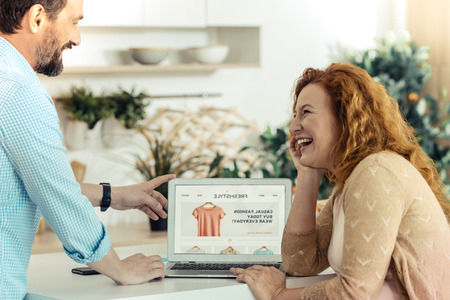 Positive woman looking at her husbandの写真素材
