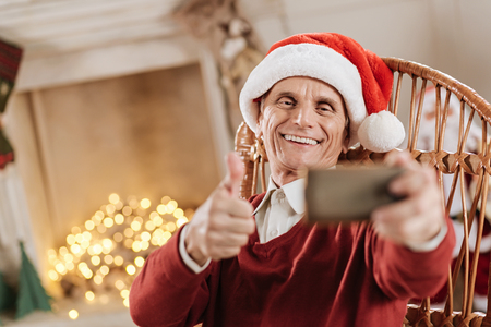 Pleased man raising his forefingerの写真素材