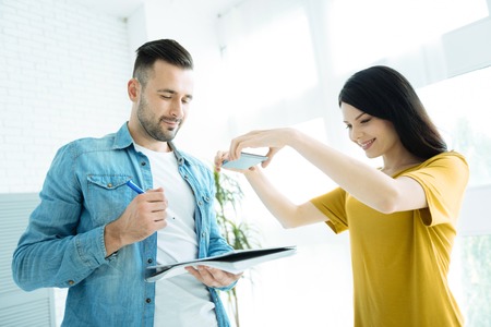 Millennial colleagues working on project togetherの写真素材