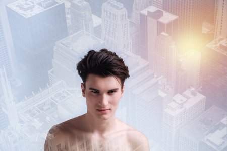 Positive model standing in urban surroundingの写真素材