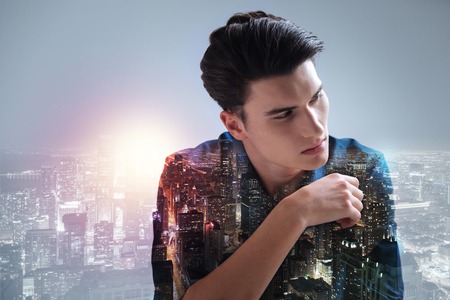 Good looking teenager averting his eyesの写真素材