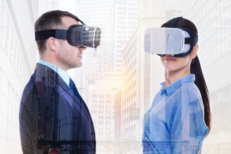 Young businesspeople wearing VR headsets