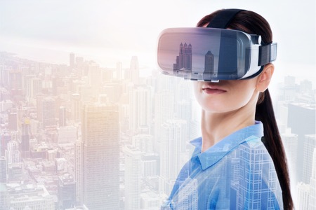 Pretty young woman posing in a VR headset