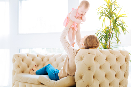 Beautiful baby girl showing her emotionsの写真素材