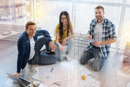 Three partners working at one project together