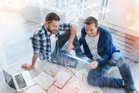 Top view picture of two males that reading taskの写真素材