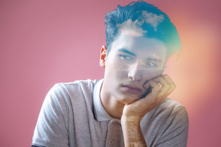 Beautiful dreams. Pleasant thoughtful nice man looking aside and imagining the sky while feeling dreamyの写真素材