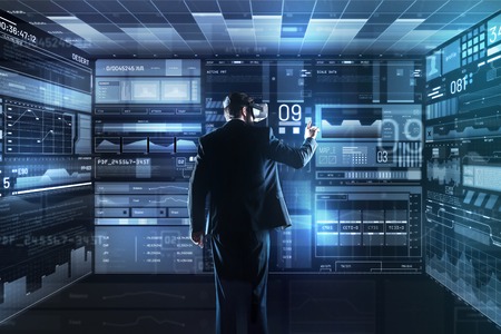 Clever enthusiastic reliable programmer wearing virtual reality glasses while being in his...