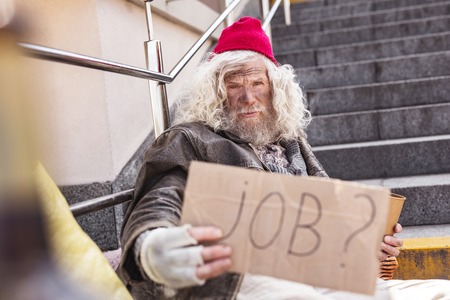 I need money. Serious poor man needing a job while having no moneyの写真素材