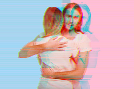 Hugging couple. Young loving couple hugging and feeling calm while standing against the colorful...