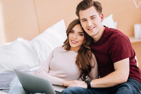 Handsome man being happy while spending time with his future wife