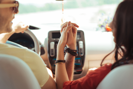 Loving modern couple wearing heir traditional bracelets while traveling togetherの写真素材
