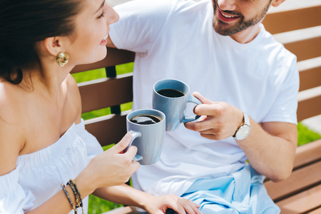 Happy nice people looking at each other while enjoying their teaの写真素材