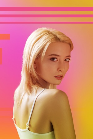 Popular actress. Famous young actress turning her head and looking calm while looking at the...