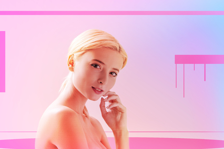 Positive mood. Joyful positive woman smiling to you while touching her cheekの写真素材