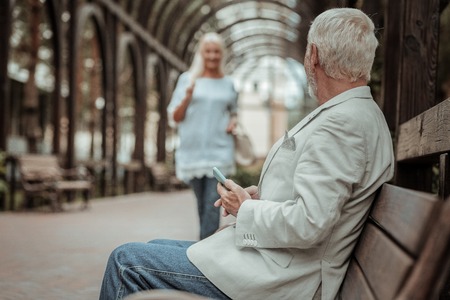 Her silhouette. Delighted female person expressing positivity while walking in parkの写真素材
