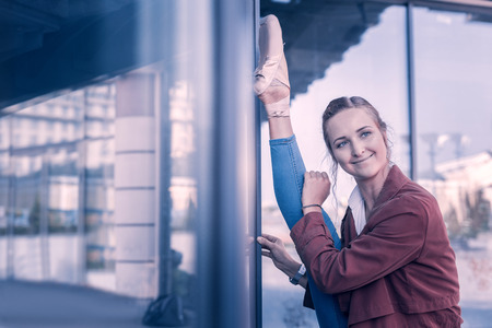 I am happy. Attractive young ballerina smiling while being in a great moodの写真素材