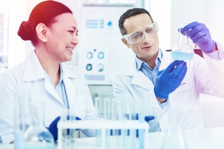 Smart intelligent people working in the laboratory together while doing the researchの写真素材