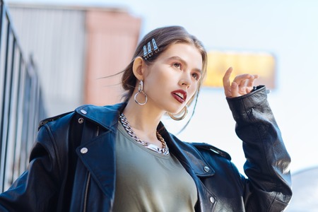 Eye shades. Appealing young fashion model with light pink eye shades and bright lips posing for photoの写真素材