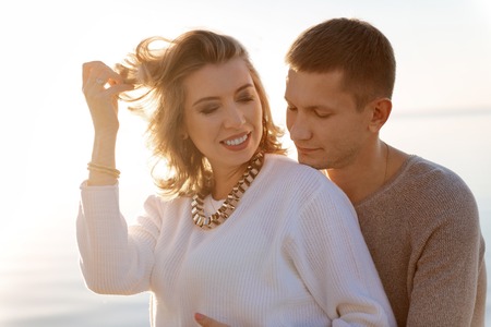 Having a child. A happy young family expecting their first babyの写真素材