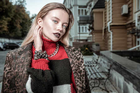 Elegant woman. Close up of blue-eyed elegant woman wearing nice clothes and accessoriesの写真素材