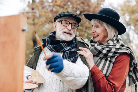 Love you. Kind mature man expressing positivity while speaking about his hobbyの写真素材
