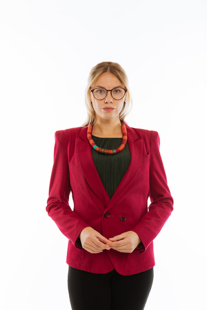 Successful businesswoman. Serious confident woman looking at you while being ready to workの写真素材