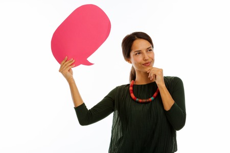 Pleasant emotions. Happy cheerful woman thinking about what to say while being in a good moodの写真素材