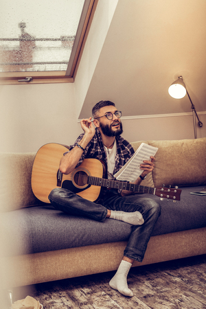 New melody. Nice creative man thinking about his music while having the inspirationの写真素材