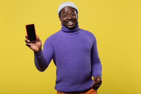 It is mine. Joyful male person keeping smile on his face while posing on cameraの写真素材